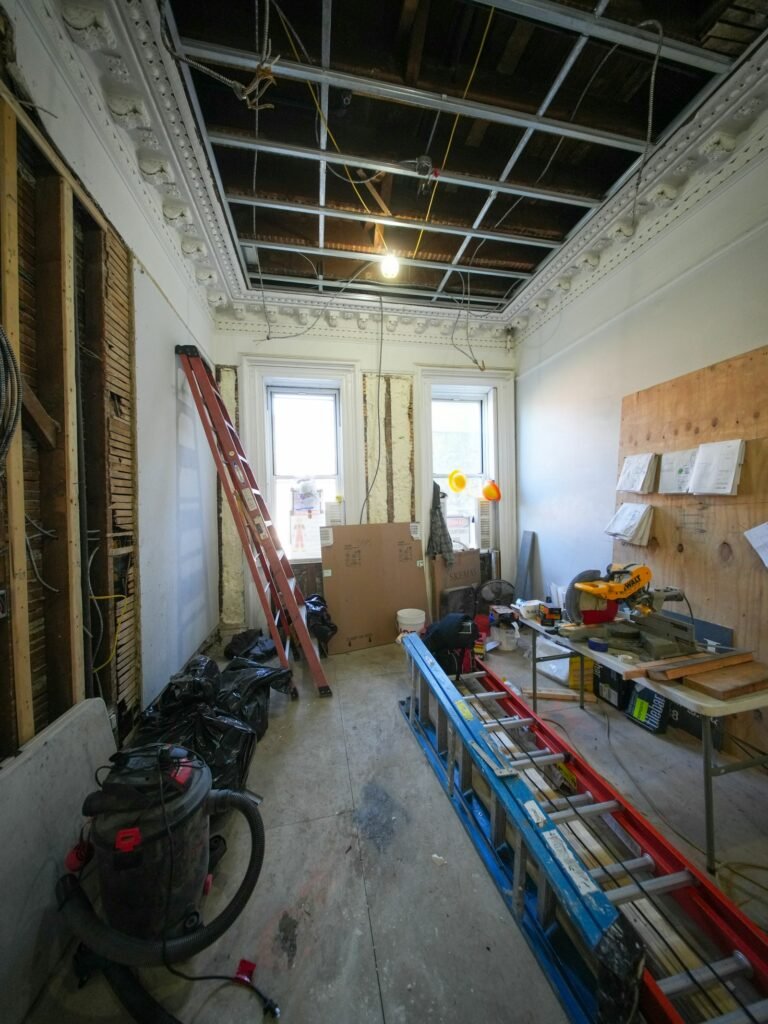 Office fit-out site before handover with tools and ladders